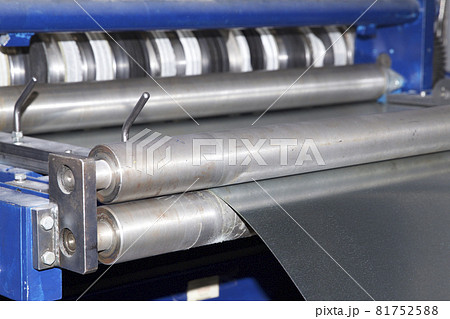 Process of cutting a wide sheet of metal into narrow strips on a machine, Russia 81752588