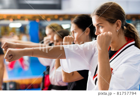 Women with instructor during self defense course Women with instructor during self defense course 81757794