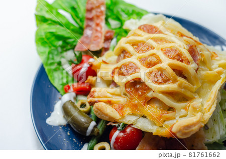 Chicken en croute, chicken breast inner fillets with mature cheddar cheese and beechwood smoked streaky bacon in a puff pastry lattice Chicken en croute, chicken breast inner fillets with mature cheddar cheese and beechwood smoked streaky bacon in a puff pastry lattice 81761662