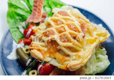 Chicken en croute, chicken breast inner fillets with mature cheddar cheese and beechwood smoked streaky bacon in a puff pastry lattice Chicken en croute, chicken breast inner fillets with mature cheddar cheese and beechwood smoked streaky bacon in a puff pastry lattice 81761663