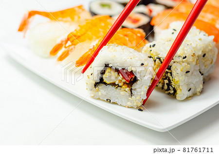 Set of smoked salmon nigiri, Ebi king prawn nigiri, katsu chicken and red pepper California roll, cucumber with wasabi hosomaki roll and red pepper hosomaki roll Set of smoked salmon nigiri, Ebi king prawn nigiri, katsu chicken and red pepper California roll, cucumber with wasabi hosomaki roll and red pepper hosomaki roll 81761711