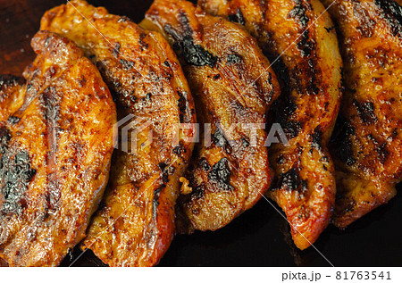 Fresh and juicy pork loin steaks, grilled meats on the wooden board Fresh and juicy pork loin steaks, grilled meats on the wooden board 81763541