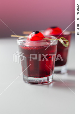 Scary drinks shots made with tequila, grenadine and tabasco decorated with jelly eyeball 81763682