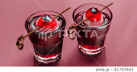 Scary drinks shots made with tequila, grenadine and tabasco decorated with jelly eyeball 81763683