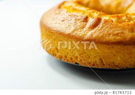 Freshly made madeira ring loaf cake decorated on white background 81763713