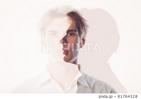 Multiple exposure portrait of young european caucasian man with positive smile and serious sad facial expression. Mental health, depression and emotions concept. 81764328