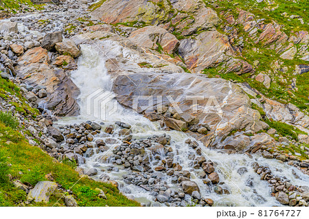 Wild alpine waterfall on Schlatenbach mountain stream. Gschloesstal Valley, Hohe Tauern National Park, East Tyrol, Austrian Alps Wild alpine waterfall on Schlatenbach mountain stream. Gschloesstal Valley, Hohe Tauern National Park, East Tyrol, Austrian Alps 81764727