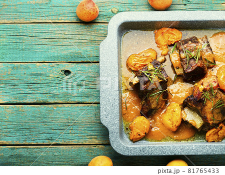 Beef ribs in apricots in baking dish Beef ribs in apricots in baking dish 81765433