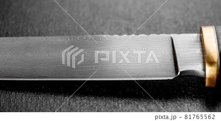 Handmade beautiful hunting knife with a sharp gray blade Handmade beautiful hunting knife with a sharp gray blade 81765562