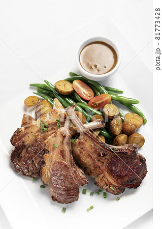 australian organic lamb chops with gravy meal on white backgroundv australian organic lamb chops with gravy meal on white backgroundv 81773428