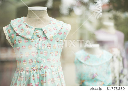 young girl fashion dress in childrenswear fashion shop window young girl fashion dress in childrenswear fashion shop window 81773880
