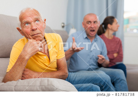 Upset senior man sitting on sofa, after quarreling with family Upset senior man sitting on sofa, after quarreling with family 81781738