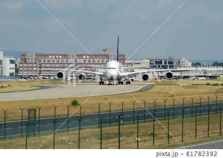 FRANKFURT, GERMANY - JUN 09th, 2017: Airbus A380 of Lufthansa with registration D-AIMH moves on taxiway by tow truck before departure from FRA airport 81782392