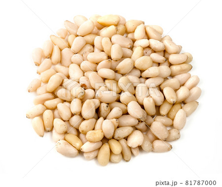 handful of unpeeled pine nuts closeup on white background 81787000