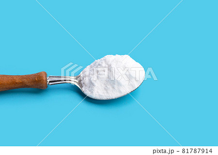 Baking soda on blue background. 81787914