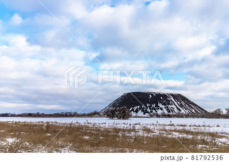 Slagheap against the background of a cloudy sky. Slagheap against the background of a cloudy sky. 81792536