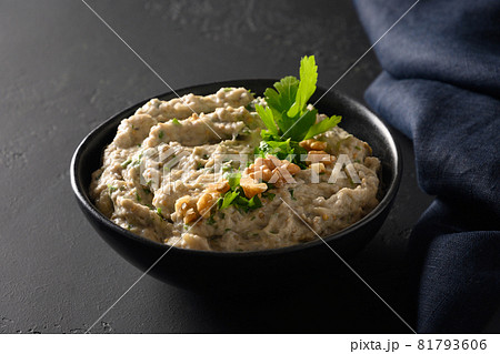 Baba ganoush Levantine cuisine appetizer from baked eggplant with parsley, garlic and olive oil. Close up. Baba ganoush Levantine cuisine appetizer from baked eggplant with parsley, garlic and olive oil. Close up. 81793606