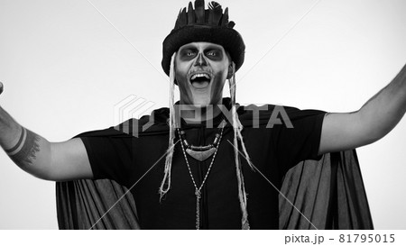 Happy creepy man with skeleton makeup celebrating win, emotionally rejoicing in victory success 81795015