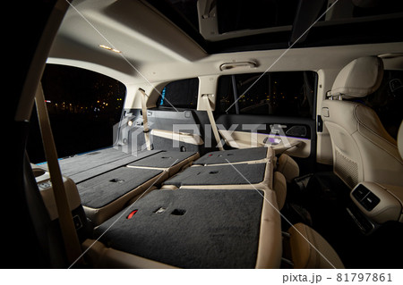 oomy empty interior of premium suv. rear seats folded in flat flor in luxury expencive suv car, side view of flat flor trunk oomy empty interior of premium suv. rear seats folded in flat flor in luxury expencive suv car, side view of flat flor trunk 81797861