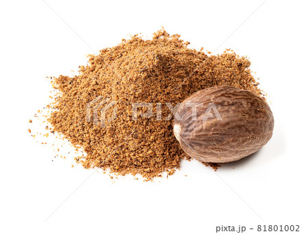 handful of whole nutmeg seed and powder closeup on white background handful of whole nutmeg seed and powder closeup on white background 81801002