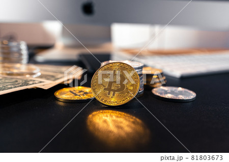 Bitcoin coins and money on the business desk 81803673