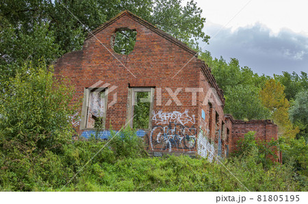 Facade of an abandoned brick building of a water pumping station in a city park Facade of an abandoned brick building of a water pumping station in a city park 81805195