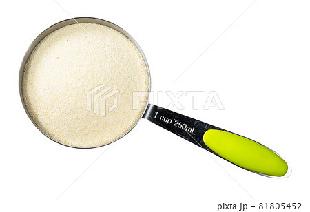 top view of raw manna croup (semolina from soft wheat) in measuring cup cutout on white background top view of raw manna croup (semolina from soft wheat) in measuring cup cutout on white background 81805452