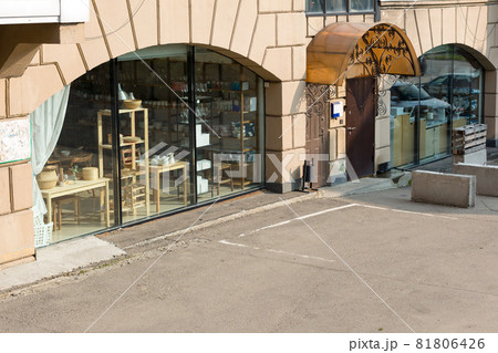 Empty parking space in front of a large shop window Empty parking space in front of a large shop window 81806426