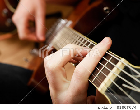 Playing guitar Playing guitar 81808074