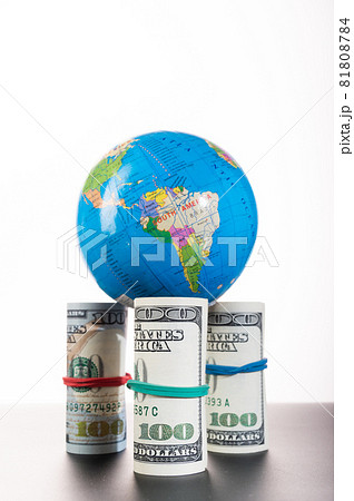 Chinese globe standing on money. Globe and money isolate. Financial stability of the world. Chinese globe standing on money. Globe and money isolate. Financial stability of the world. 81808784