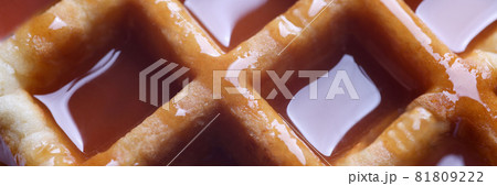 Fresh waffle with stewed honey. Making sweets at home closeup 81809222
