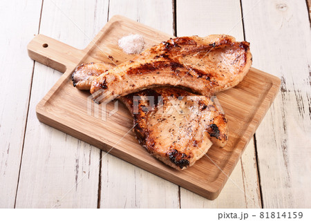 Two grilled tomahawk pork chops Two grilled tomahawk pork chops 81814159