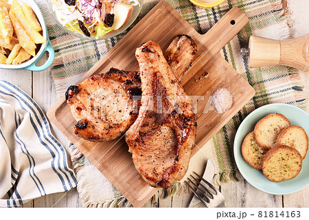 Two grilled tomahawk pork chops 81814163