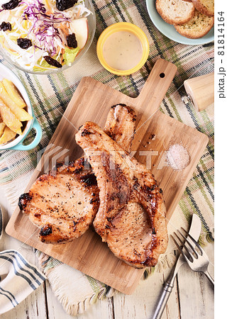 Two grilled tomahawk pork chops Two grilled tomahawk pork chops 81814164