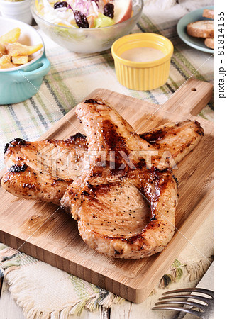 Two grilled tomahawk pork chops Two grilled tomahawk pork chops 81814165