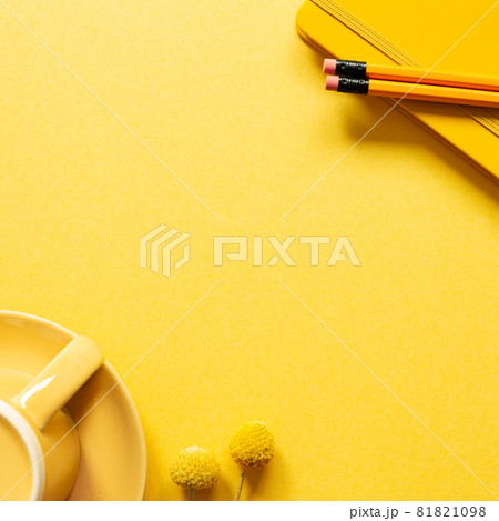 Notebook, pencil, coffee cup on yellow background. flat lay, top view, copy space. workspace 81821098