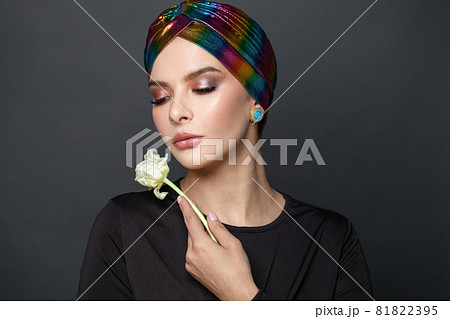 Beautiful woman in traditional turban hat on her head 81822395