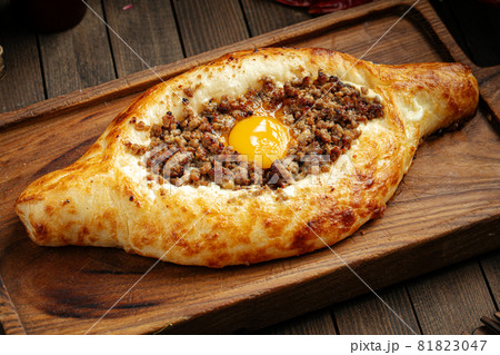 Georgian adjarian khachapuri with egg and mince Georgian adjarian khachapuri with egg and mince 81823047