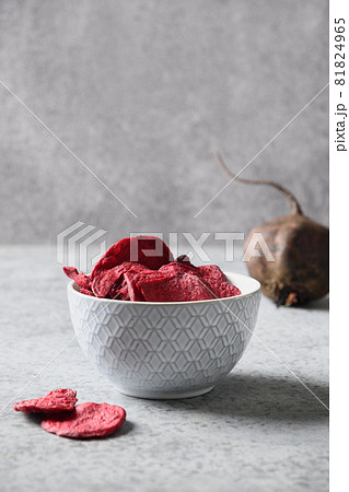 Vegetable beetroot vegan chips in gray bowl. Vegetable beetroot vegan chips in gray bowl. 81824965
