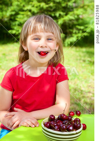 Child eating wild cherry Child eating wild cherry 81825988