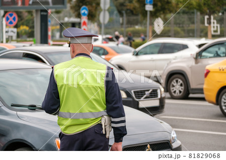 Traffic police officer works on major street in a big city, day time 81829068