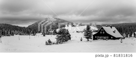 Jizerka Village and Bukovec Mounain in winter. Jizera Mountains, Czech Republic. Black and white image. Jizerka Village and Bukovec Mounain in winter. Jizera Mountains, Czech Republic. Black and white image. 81831816