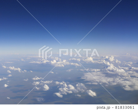 Top view of the earth with clouds. Hot air balloon trip. Extreme tourism in the form of flights on unusual aircraft. Top view of the earth with clouds. Hot air balloon trip. Extreme tourism in the form of flights on unusual aircraft. 81833061