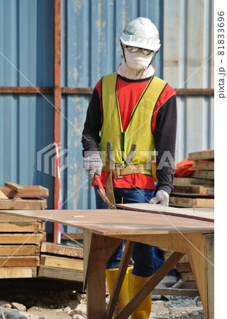MALACCA, MALAYSIA -MAY 25, 2016: Construction workers fabricating timber form work at the construction site in Malacca, Malaysia. The form work was mainly made from timber and plywood. MALACCA, MALAYSIA -MAY 25, 2016: Construction workers fabricating timber form work at the construction site in Malacca, Malaysia. The form work was mainly made from timber and plywood. 81833696