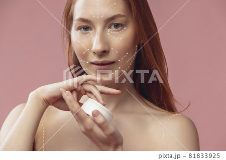 Close-up portrait of young, beautiful and healthy woman with arrows on her face. The spa, surgery, face lifting and skin care concept Close-up portrait of young, beautiful and healthy woman with arrows on her face. The spa, surgery, face lifting and skin care concept 81833925
