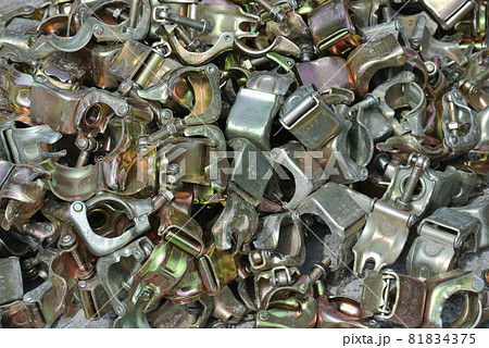 SELANGOR, MALAYSIA -JULY 10, 2016: Scaffolding connector detail at the construction site. The connector bind or tie scaffolding or safety pipe together. SELANGOR, MALAYSIA -JULY 10, 2016: Scaffolding connector detail at the construction site. The connector bind or tie scaffolding or safety pipe together. 81834375