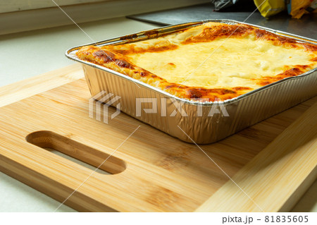 Delicious baked lasagne in an aluminum bowl Delicious baked lasagne in an aluminum bowl 81835605