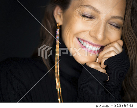 Portrait of a smiling 40 years old woman with closed eyes. Psychology and feminine health concept. Portrait of a smiling 40 years old woman with closed eyes. Psychology and feminine health concept. 81836442