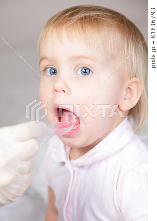 Child taking a medicine Child taking a medicine 81836793