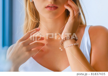 close-up portrait of beautiful girl's lower part of face and manicured fingers 81837435